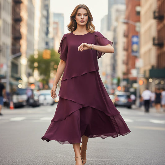 Elegáns, réteges ruha lebegő ujjakkal