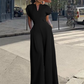 Női V-nyakú, széles szárú jumpsuit