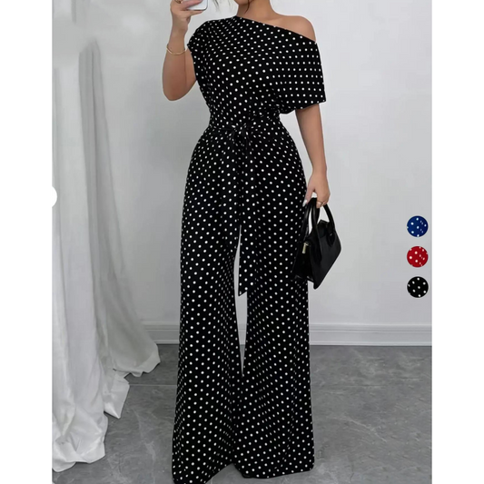 Elegáns aszimmetrikus nyakkivágású pöttyös jumpsuit