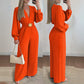 Elegáns V-nyakú, széles szárú jumpsuit övvel