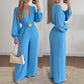 Elegáns V-nyakú, széles szárú jumpsuit övvel