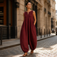 Női ujjatlan, V-nyakú, széles szárú jumpsuit zsebekkel