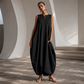 Női ujjatlan, V-nyakú, széles szárú jumpsuit zsebekkel